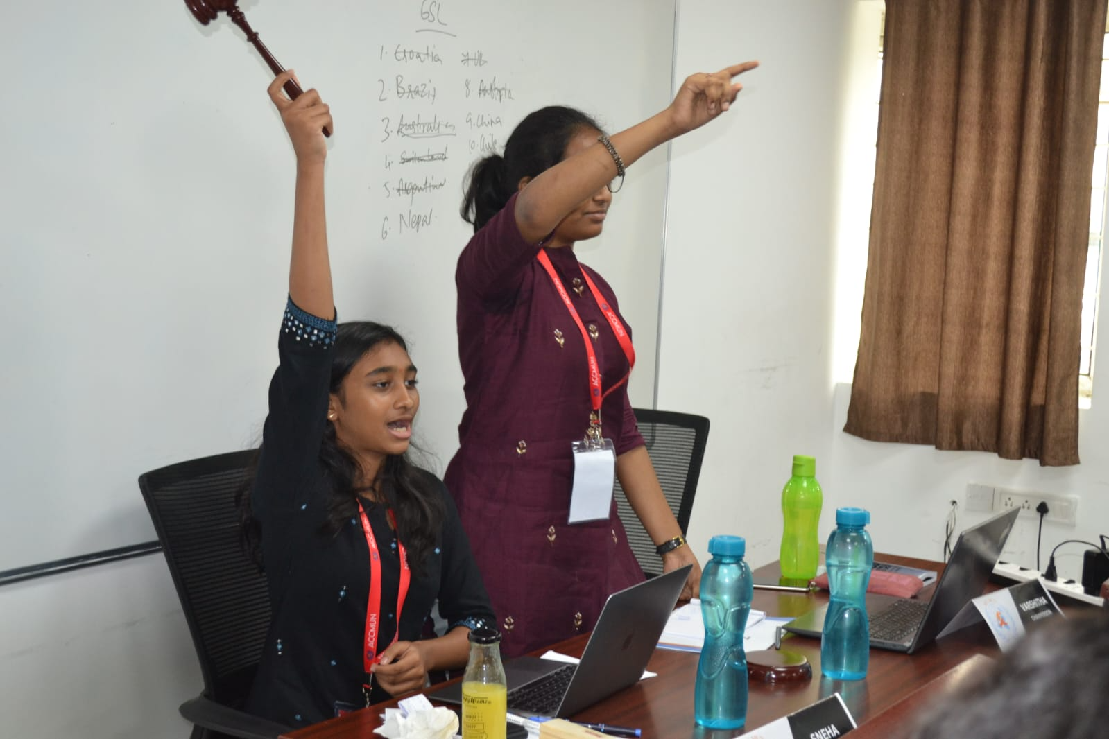 ACCMUN 2.0 chair holding gavel
